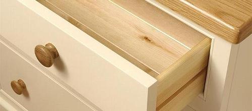 Solid oak side table close up of open drawers